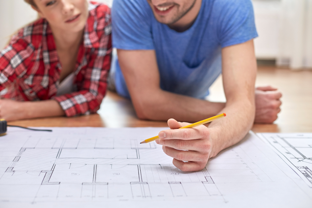 couple reviewing floor plans, renovation, home remodel