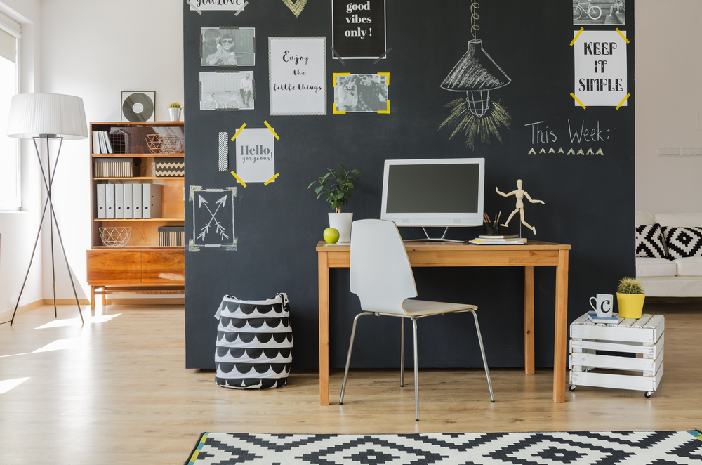 home office space, desk, blackboard partition
