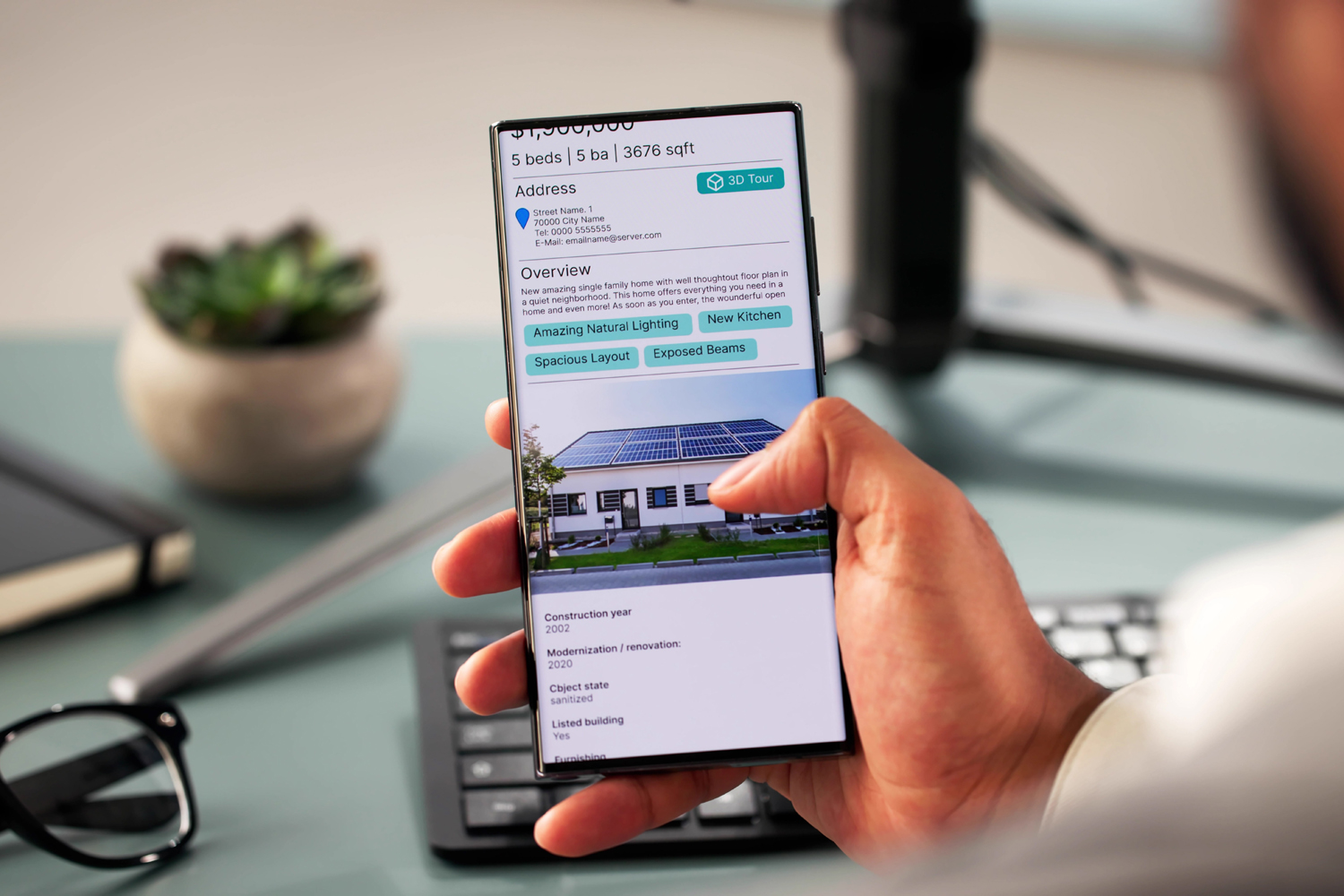 man scrolling real estate listing, phone, desktop