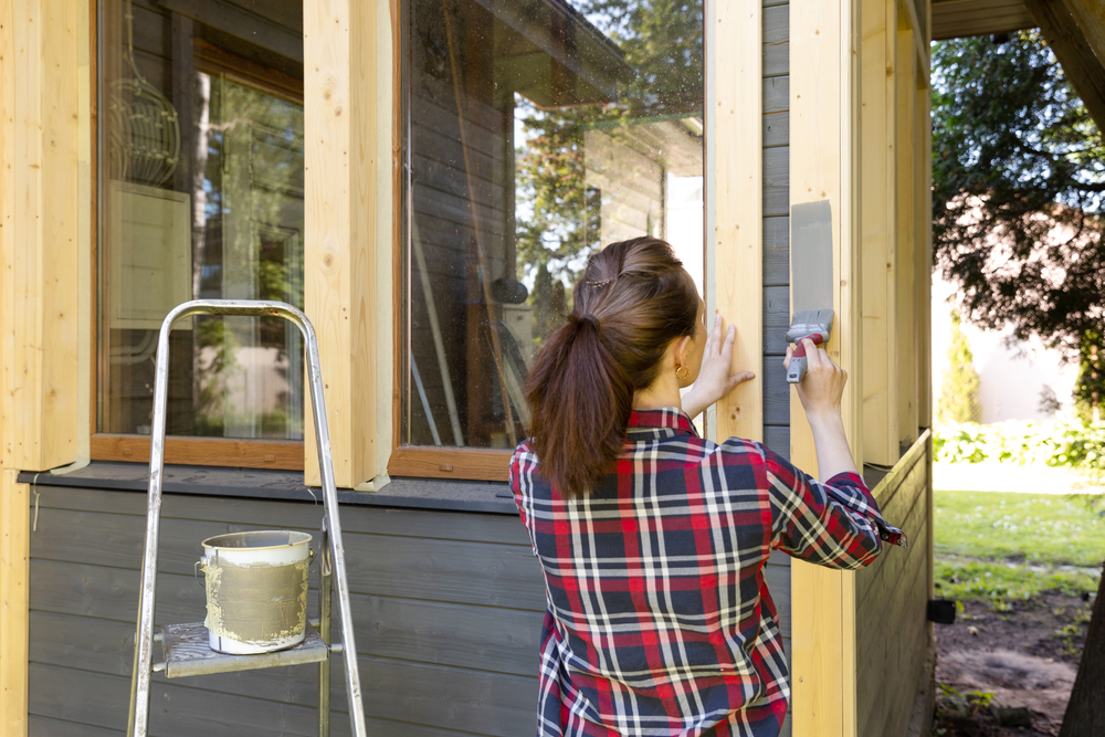 homeowner painting exterior, property maintenance, summer