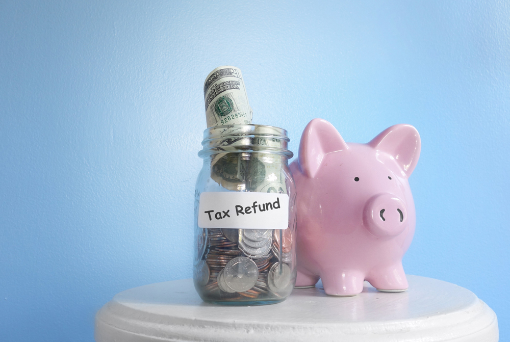 piggy bank, jar with cash, tax refund