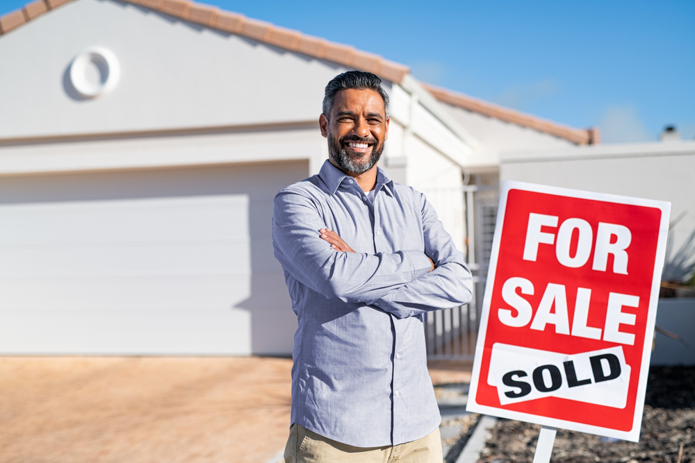 real estate entrepreneur, sold sign, investment property