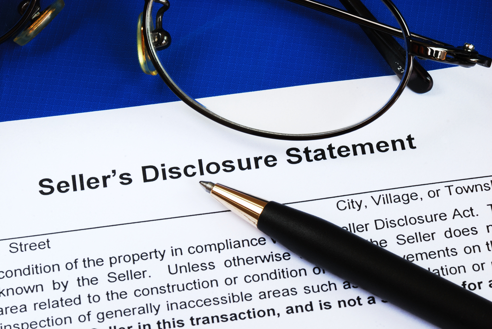 seller disclosure statement, pen, glasses