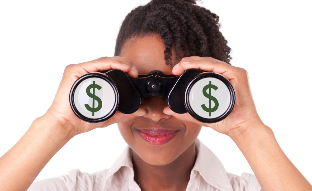 woman using binoculars, dollar signs