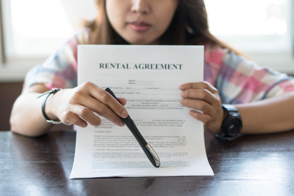 woman with rental agreement, contract